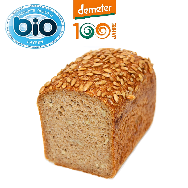 Vegan Wonne – saftig-goldbraunes Roggen-Dinkelbrot mit 100 % gekeimtem Demeter-Getreide und knackigen Sonnenblumenkernen, handwerklich gebacken.